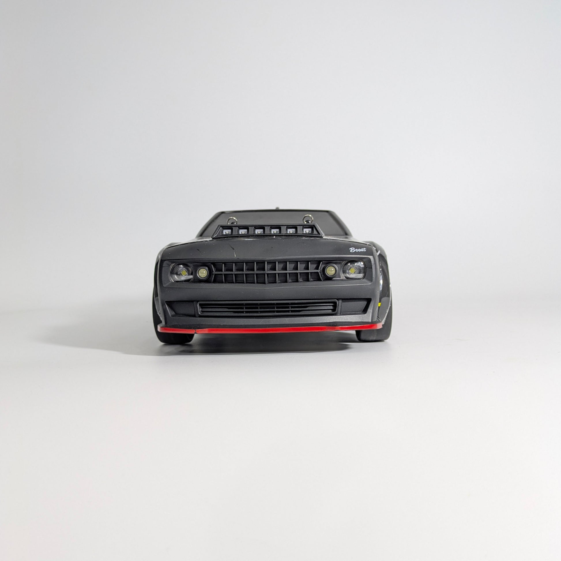 Outdoor shot of BeingBoys Brushless Beast Black RC car, RC community India.
